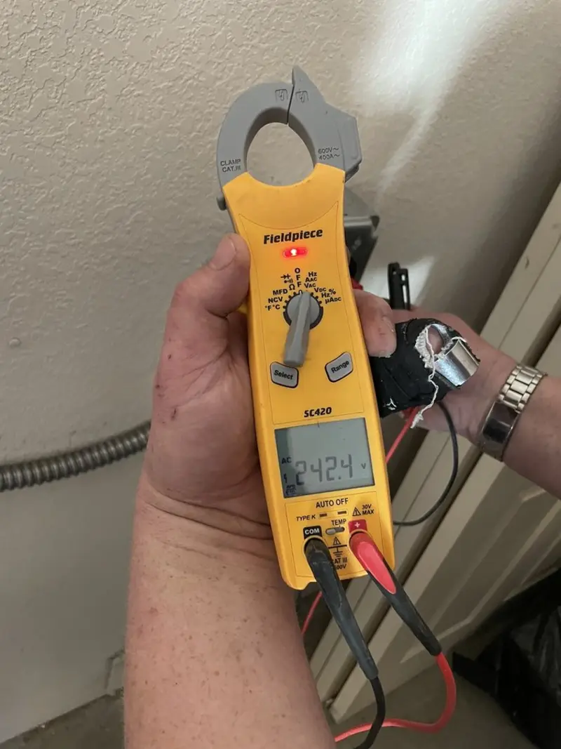 Voltage testing with clamp meter during Electrical Installation Services in Windsor Locks